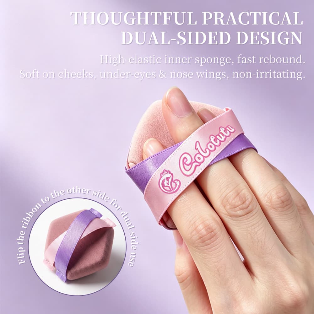 Dual-sided Colotutu cushion puff held with crossed finger straps
